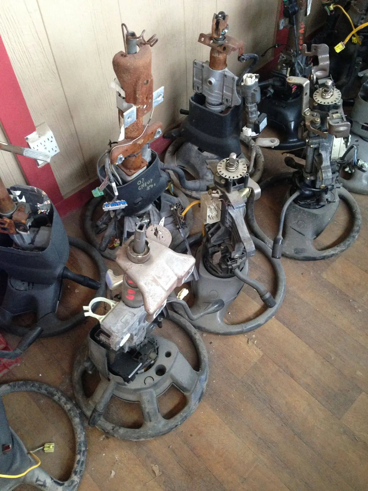 Headlights and electrical components on the shelf at a full-service Indianapolis salvage yard